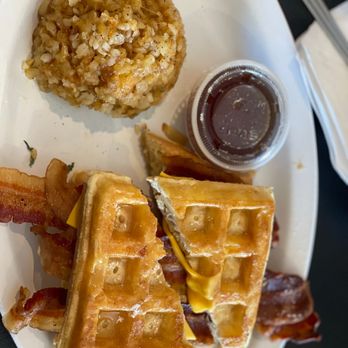Happy Cafe - Bacon, egg and cheese Waffle Sandwich with a side of hash casserole and syrup - Cafes Near Me - Virginia Beach, Virginia Happy Cafe - Bacon, egg and cheese Waffle Sandwich with a side of hash casserole and syrup - Cafes Near Me - Virginia Beach, Virginia