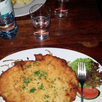 Arema - Schnitzel Bratkartof, salad, and potatoes(under the schnitzel) - Cafes Near Me - Berlin, BE
