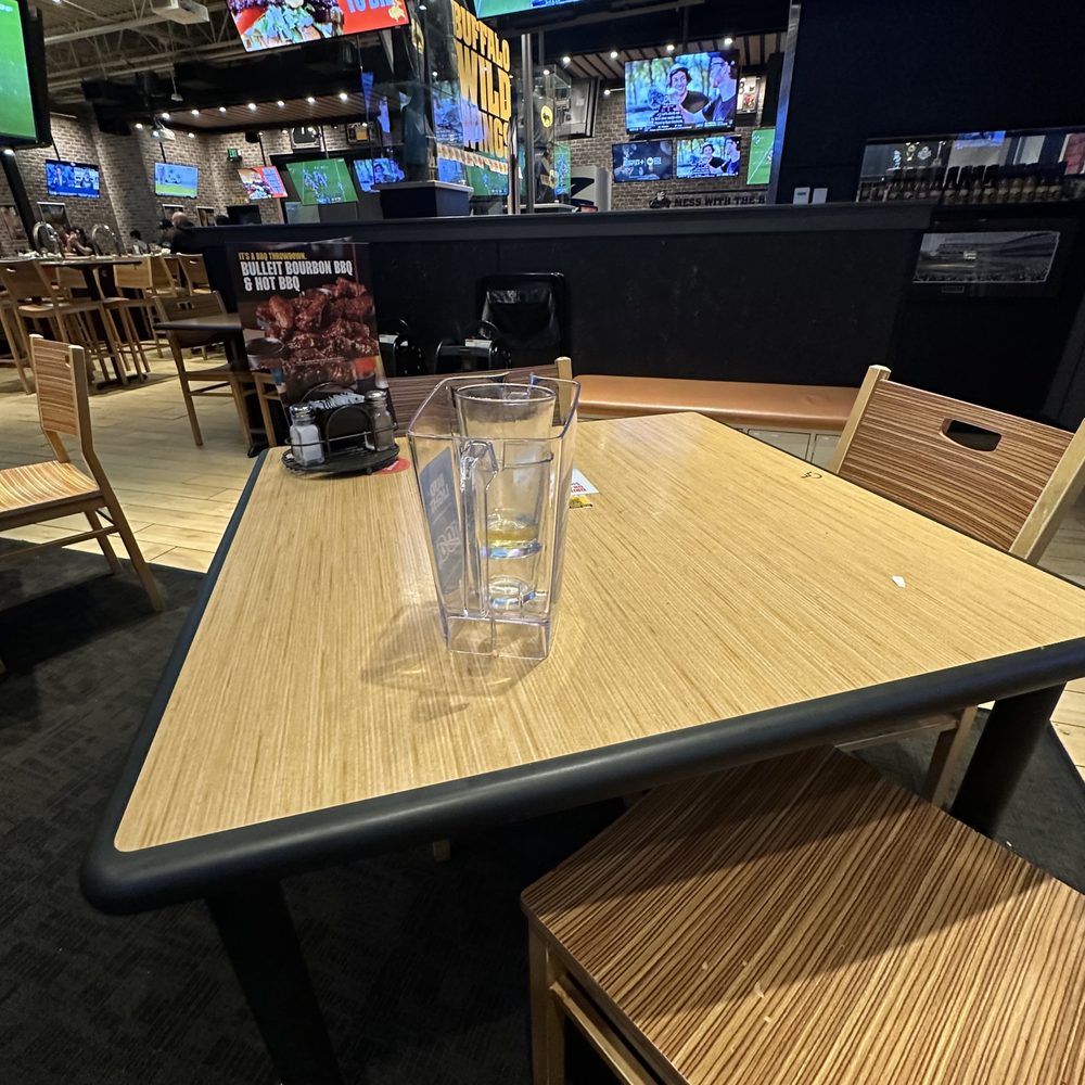 Buffalo Wild Wings - Another table that sat with used glassware. - Chicken Wings Near Me - Sheridan, Colorado