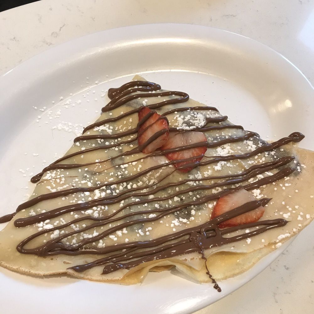 Nutella Cafe - Strawberry crepe with Nutella drizzle. Why my daughter skipped whipped cream as an add-on is a mystery. - Desserts Near Me - Chicago, Illinois Nutella Cafe - Strawberry crepe with Nutella drizzle. Why my daughter skipped whipped cream as an add-on is a mystery. - Desserts Near Me - Chicago, Illinois