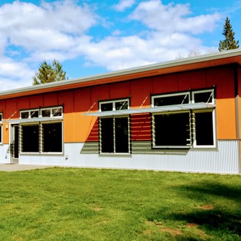 Home Resource Company - a modern home with orange exterior - General Contractors Near Me - Olympia, Washington Home Resource Company - a modern home with orange exterior - General Contractors Near Me - Olympia, Washington