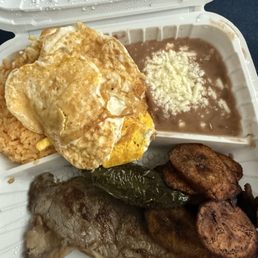 2 piece Churrasco served with 2 fried eggs, yellow plantain rice and beans, also comes with about 6 pieces of warm corn tortillas.