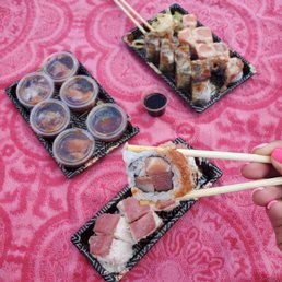Snow dragon roll $13, Orochi roll $12, White dragon roll $12 and Hamachi ceviche $9 (in cups)
