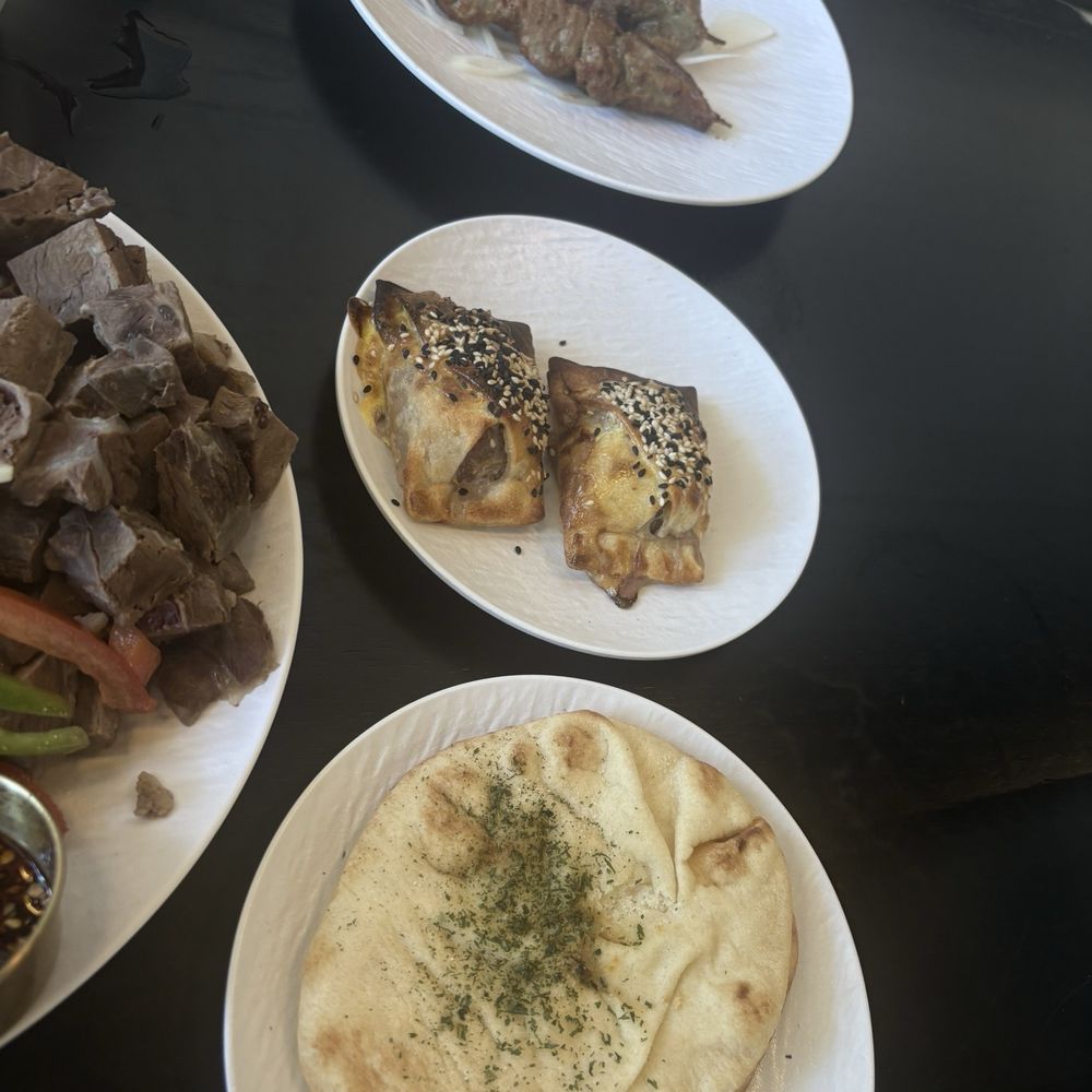 Lamb kebab, samsa, garlic naan Lamb kebab, samsa, garlic naan