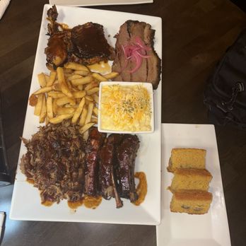 JJ's Cuisine - The barbecue platter with corn bread and Mac and cheese - Steakhouses Near Me - Homestead, Florida JJ's Cuisine - The barbecue platter with corn bread and Mac and cheese - Steakhouses Near Me - Homestead, Florida