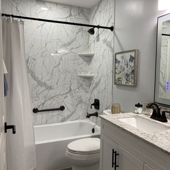 Improveit Home Remodeling - Updated hall bathroom with Calcutta marble walls and tub-shower combo. See the full Before & After at improveitusa.com/projects. - Windows Installation Near Me - Nashville, Tennessee Improveit Home Remodeling - Updated hall bathroom with Calcutta marble walls and tub-shower combo. See the full Before & After at improveitusa.com/projects. - Windows Installation Near Me - Nashville, Tennessee