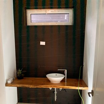 Hydrologic Mechanical - Live edge bathroom counter with slate accent wall. - Plumbing Near Me Hydrologic Mechanical - Live edge bathroom counter with slate accent wall. - Plumbing Near Me