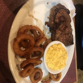 Pete's Place - Pete's Ribeye with inion rings and Mac and Cheese. The steak is much bigger than it looks here. - Pubs Near Me - Maynardville, Tennessee