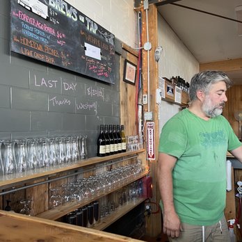 Ledge Hill Brewing - a man pouring a glass of wine - Breweries Near Me - Ticonderoga, New York Ledge Hill Brewing - a man pouring a glass of wine - Breweries Near Me - Ticonderoga, New York