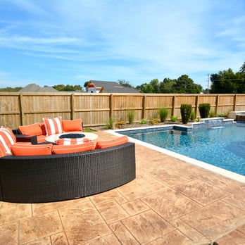Parrot Bay Pools - Geometric swimming pool with built-in ledges, spillover spa, and fountain - Hot Tub & Pool Near Me - Little Rock, Arkansas Parrot Bay Pools - Geometric swimming pool with built-in ledges, spillover spa, and fountain - Hot Tub & Pool Near Me - Little Rock, Arkansas
