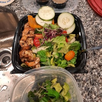 Escovitchez - jerk shrimp over a salad. - Caribbean Near Me - Snellville, Georgia