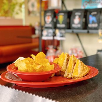 Becca's Cafe, Bistro & Catering - a sandwich and chips on a red plate - Cafes Near Me - Weston, Wisconsin Becca's Cafe, Bistro & Catering - a sandwich and chips on a red plate - Cafes Near Me - Weston, Wisconsin