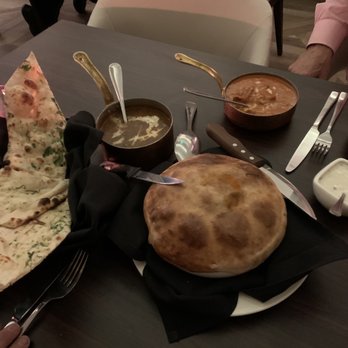 Verandah - Garlic naan : butter chicken ; Chicken Biryani - Indian Near Me - Houston, Texas
