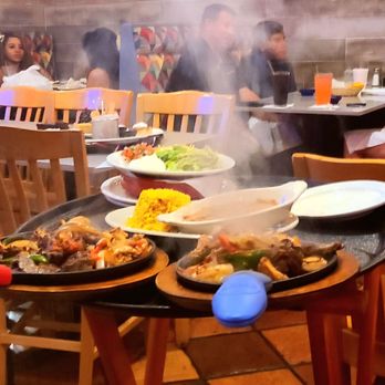 El Mariachi - Sizzling fajitas - you can smell the excitement in this photo! - Mexican Near Me - Coral Springs, Florida
