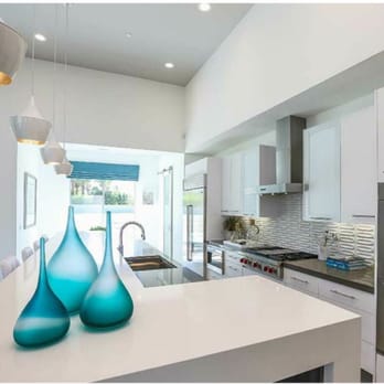 Nature'stone - a modern kitchen with stainless steel appliances - General Contractors Near Me - North Palm Springs, California Nature'stone - a modern kitchen with stainless steel appliances - General Contractors Near Me - North Palm Springs, California