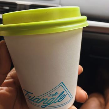 Café Triangle - a hand holding a coffee cup - Cafes Near Me - Montreal, Quebec Café Triangle - a hand holding a coffee cup - Cafes Near Me - Montreal, Quebec