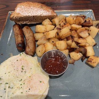 First Watch - Two eggs over easy, potatoes with ketchup, sausage links and toast. - Breakfast & Brunch Near Me - Hamilton, Ohio