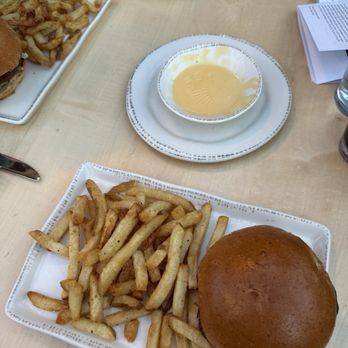Von Trapp Brewing Bierhall Restaurant - Burger with fries and cheese sauce from our pretzels - Austrian Near Me - Stowe, Vermont Von Trapp Brewing Bierhall Restaurant - Burger with fries and cheese sauce from our pretzels - Austrian Near Me - Stowe, Vermont