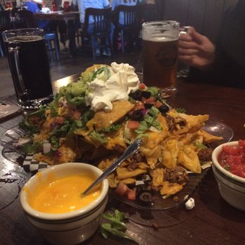 Lucky's 13 Pub - The "small" nacho portion. The salsa and nacho cheese on the side is great too! - American Near Me - Spearfish, South Dakota Lucky's 13 Pub - The "small" nacho portion. The salsa and nacho cheese on the side is great too! - American Near Me - Spearfish, South Dakota