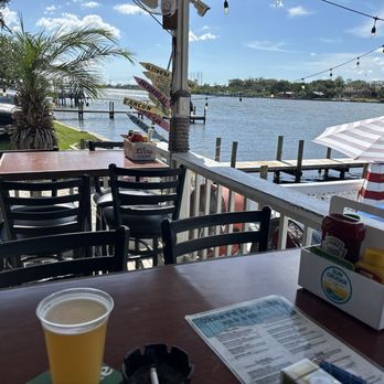 Jerry’s Dockside Bar & Grill - High top table right on the water - New American Near Me - Gibsonton, Florida Jerry’s Dockside Bar & Grill - High top table right on the water - New American Near Me - Gibsonton, Florida