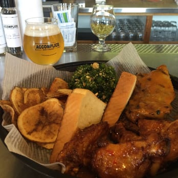 Accomplice Beer Company - Thai Chili wings, Carolina Mustard ribs, chips, kale salad, and a tasty cold Caught Lookin Blonde Ale by Black Tooth. - Breweries Near Me - Cheyenne, Wyoming Accomplice Beer Company - Thai Chili wings, Carolina Mustard ribs, chips, kale salad, and a tasty cold Caught Lookin Blonde Ale by Black Tooth. - Breweries Near Me - Cheyenne, Wyoming
