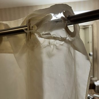 Bay Landing Hotel - Old, ripped shower curtain - Hotels Near Me - Burlingame, California Bay Landing Hotel - Old, ripped shower curtain - Hotels Near Me - Burlingame, California