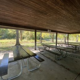 Picnic shelter with roped off middle tables to social distance Picnic shelter with roped off middle tables to social distance