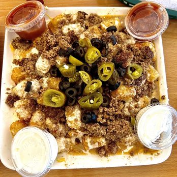 Beach Front Grille - Tater tot nachos! Delicious! We split them....and we were still full! - American Near Me - Flagler Beach, Florida