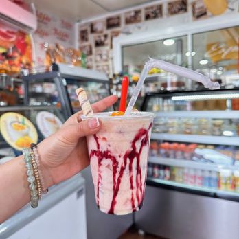 Brisas Express - a hand holding a milkshake - Colombian Near Me - Elizabeth, New Jersey Brisas Express - a hand holding a milkshake - Colombian Near Me - Elizabeth, New Jersey
