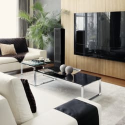 Omega Media Solutions - Sales and installation of MartinLogan floor standing speakers, a wall mounted flat screen TV, hidden stereo receiver, universal remote.