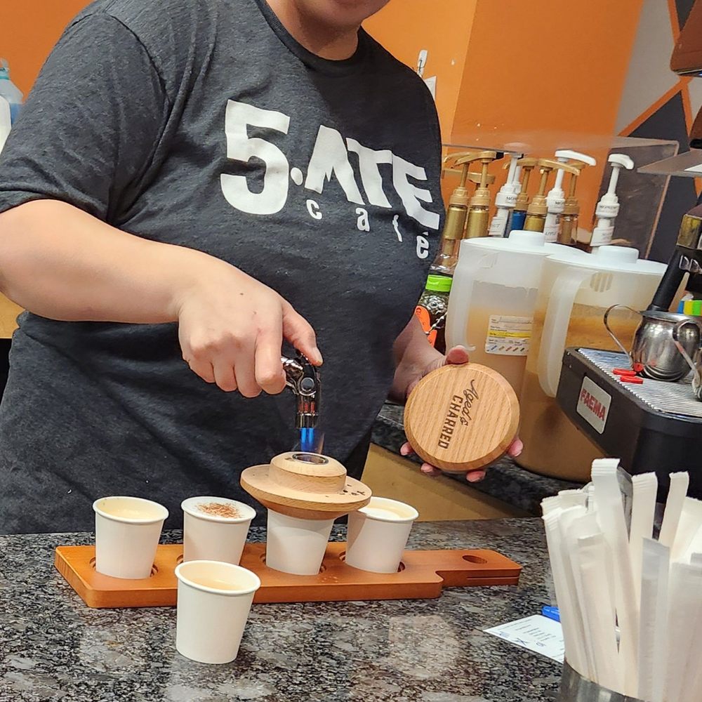 5 Ate Cafe - Talented barista making the smoked hugge latte at the climb and dine event. - Pizza Near Me - Spring, Texas