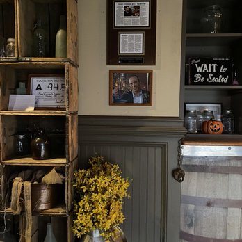 Moon Runners Saloon - a wooden barrel with flowers in it - Southern Near Me - Garner, North Carolina