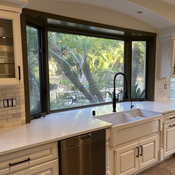 Divinity Flooring Services - a kitchen with a sink and dishwasher - Flooring Near Me