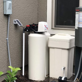 Awesome Water Treatment - Our system neatly installed behind our 3rd car garage. - Water Purification Services Near Me - St. Augustine, Florida Awesome Water Treatment - Our system neatly installed behind our 3rd car garage. - Water Purification Services Near Me - St. Augustine, Florida