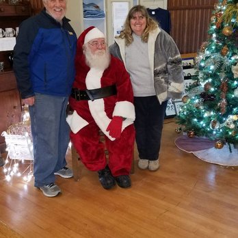 Whitney's Laundromat - Mr. And mrs. Whitney having a picture with Santa at the Standish historical Depot in Standish Michigan 2018 - Laundromat Near Me - Standish, Michigan Whitney's Laundromat - Mr. And mrs. Whitney having a picture with Santa at the Standish historical Depot in Standish Michigan 2018 - Laundromat Near Me - Standish, Michigan