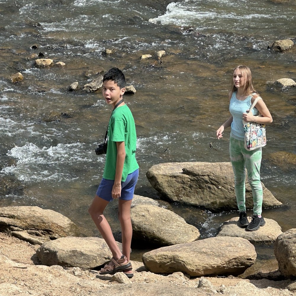 Fall Lake Falls - Itzhak and Elena hanging out at the bottom of the fall - Public Art Near Me - Greenville, South Carolina