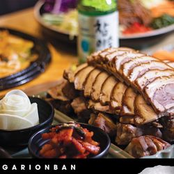 Garionban - Tender sliced jokbal with fresh banchan--rich, savory flavors perfect with a cold bottle of soju.