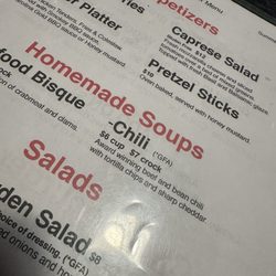 The Pit - Bad menu picture. I would like to see what award the chili won.