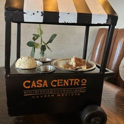 Casa Centro Modern Mexican - Churro cheesecake bites, served with caramel and chocolate dipping sauces and vanilla ice cream in this unique caddy!