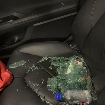 Triana - Broken glass on passenger seat of car from broken window - Apartments Near Me - Woodland Hills, California Triana - Broken glass on passenger seat of car from broken window - Apartments Near Me - Woodland Hills, California