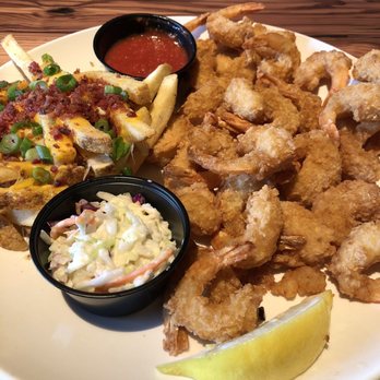 Miller's Ale House - Fried shrimp with loaded french fries and cole slaw - Sports Bars Near Me - Mcdonough, Georgia