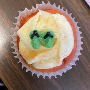 Hokulani Bake Shop - Look at the cute detail of the slippers on this delicious POG cupcake. I have another fave! - Bakeries Near Me - Honolulu, Hawaii