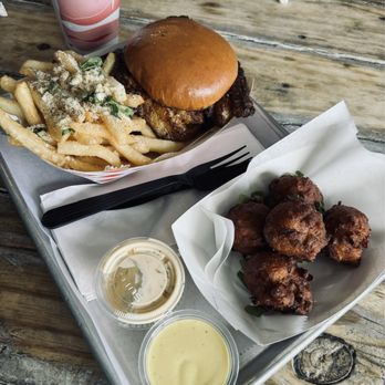Big Ray's Fish Camp - Blackened grouper sandwich with side of fries and order of conch fritters - Seafood Near Me - Tampa, Florida