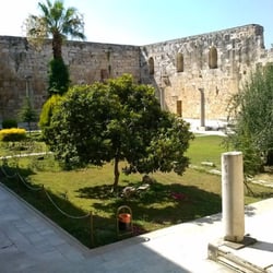 İsabey Cami - Inside the İsabey Cami courtyard. The tree to the far right in the picture covers the washing area for women.