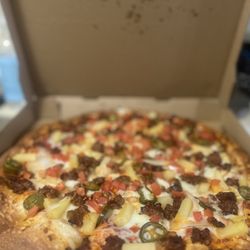 Tony's Pizza - Mexicana with pineapple - our version of a pastor pizza. Order with Canadian bacon and it's so delicious!
