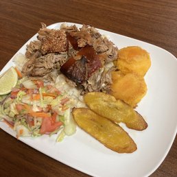 Horneado Ecuatoriana- roast pork with salad, plantains, white Andean corn and llapingachos.