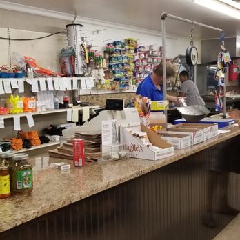 Capt Larry's Seafood Market - a man and a woman at the counter - Seafood Near Me - Belle Chasse, Louisiana Capt Larry's Seafood Market - a man and a woman at the counter - Seafood Near Me - Belle Chasse, Louisiana