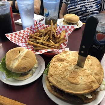 Big Jud's - The Jud's one pound burger. The burger on the left is a normal size burger. - Burgers Near Me - Rexburg, Idaho
