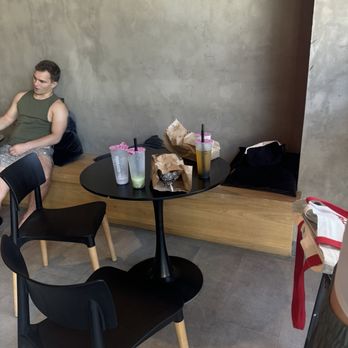 Terrazzo Tea - Table occupied by drinks and bag with no one there - Bubble Tea Near Me - Austin, Texas