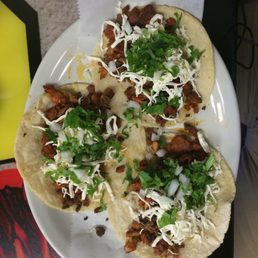 3 Pork tacos con queso from Bibi's 3 Pork tacos con queso from Bibi's